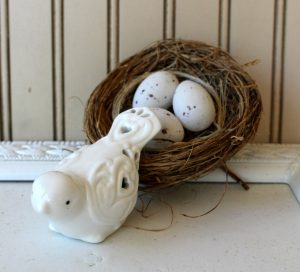 a vintage birdcage makes a beautiful easter or spring centerpiece