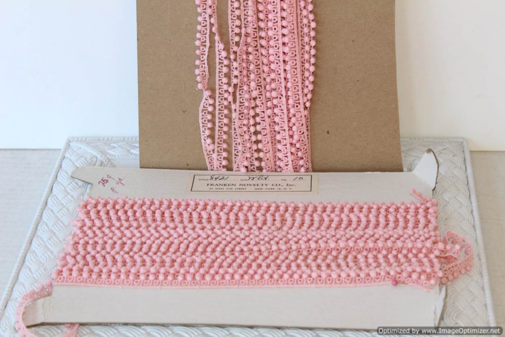 Tiny pink pom pom trim