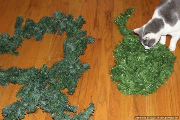 Choice of Faux Green Garlands waiting to be placed in Christmas arrangement with the red ladder choice-of-faux-garlands